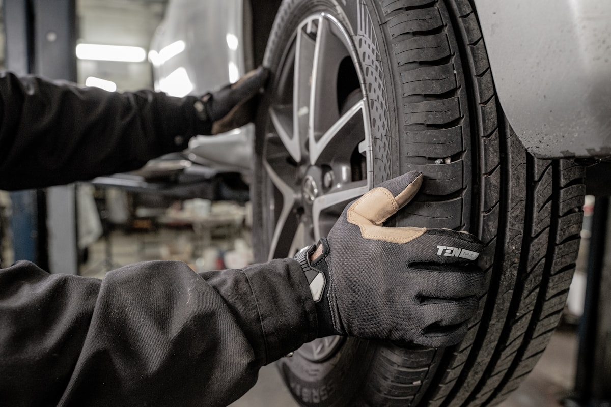 Mechanic working in a garage with hand protection